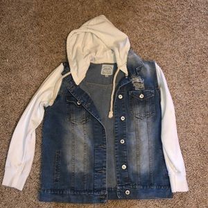 Jean jacket with white sleeves and hood.